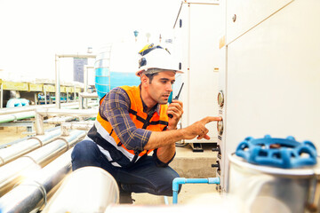 HAVC refrigeration system mechanic daily inspection refrigeration equipment on the roof building...