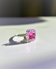 Pink sapphire and diamond ring in the sunlight.
