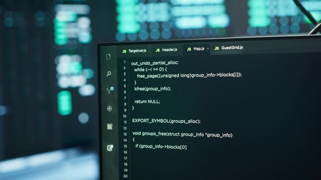 Computers in server hub used to ensure optimal performance and reliability, managing mainframes. Close up of code running on PC display in high tech data center used for overseeing network connections