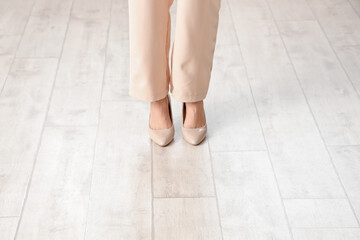 Woman standing on wooden floor. New beginning concept