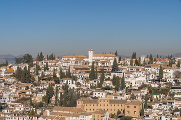 Naklejka premium San Pedro neighborhood in the city of Granada, Spain on a sunny day with blue sky in the background