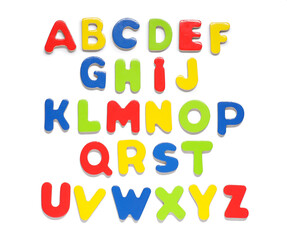 Alphabet. Many colorful magnetic letters isolated on white, top view