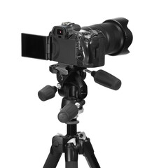 Modern camera with tripod isolated on white. Photographer's equipment