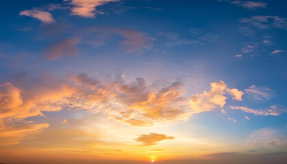 Obraz premium Beautiful of luxury soft gradient orange gold clouds and sunlight on the blue sky perfect for the background