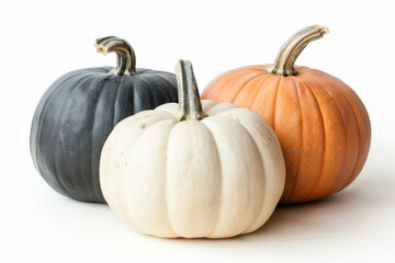 Three decorative pumpkins in black, white, and orange colors, perfect for fall and Halloween themes.