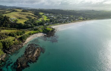 Farmland and the ocean coastline of Bream Bay in the town of Waipu, Northland, New Zealand.