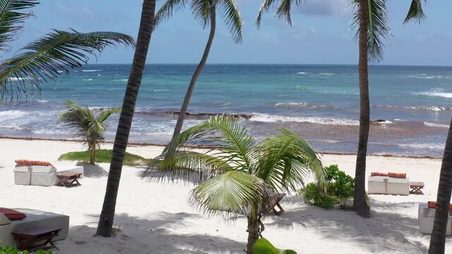Flying Out Over the Ocean, Passing Tropical Beach Greenery and Palm Trees at a Resort in Tulum