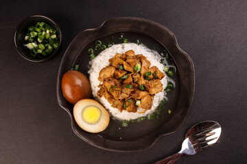 Nasi Bakmoy is Rice Topping with Sweet and Savory Chicken and Soup with Brown Boiled Egg.