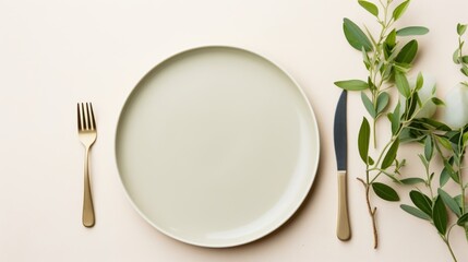 Flatlay arrangement of a chic ceramic plate on a light-colored surface 