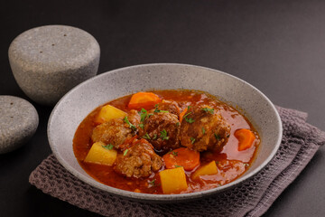 Albondigas Soup is Meatballs in Thick Vegetable Soup. Mexican and Spanish Cuisine.
