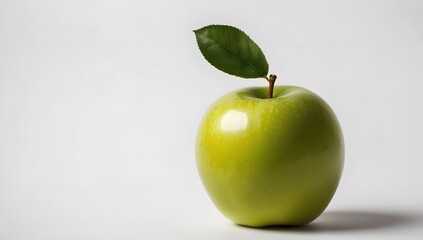 A single green apple with a leaf on a white background, the apple is smooth and shiny, and the leaf is green and vibrant