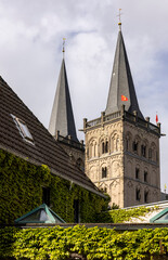 Fototapeta premium tall sharp spire of a tower building in a small town in europe 