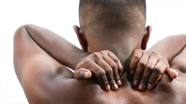 man neck, upper back and trapezius muscles with upper spine, thoracic region marked red. men touches him shoulder, neck, suffer from neck ache, nude man close up ache, upper back shoulder, pain nerve