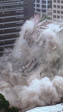 Aerial Downtown city building Implosion. Vertical