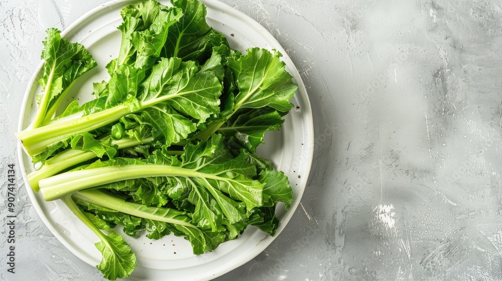 Poster turnip greens on white plate on ceramic surface