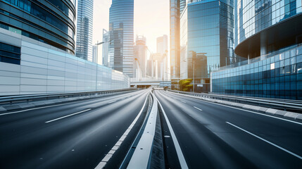 Fototapeta premium City highway and glass buildings at dawn