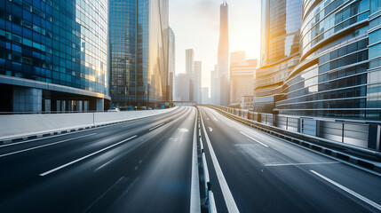 Fototapeta premium City highway and glass buildings at dawn