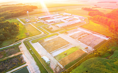 Fototapeta premium Livestock Barn, aerial view. Agricultural Buildings with farm animals. Farm Storage, Livestock Buildings with Cows. Hay Barns. Cowshed, Animal husbandry. Farm of cattle, Cow Dairy. Agronomy.