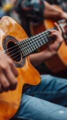 Fototapeta premium Close Up of a Person Playing Acoustic Guitar.