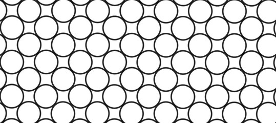 Seamless pattern with black circles in the white background