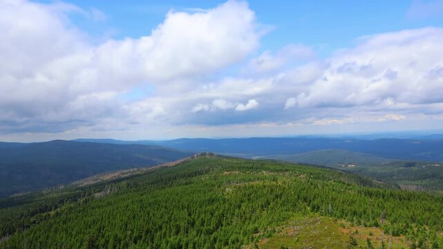 Cloud time lapse above hills, view from lookout tower Polednik, national park Sumava, Czech landscape