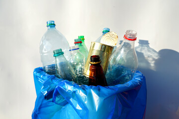 Plastic sorting for Recycling. Empty plastic bottles in trash bin sorting. Plastic bottles...