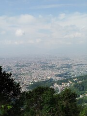 Obraz premium Beautiful view of Kathmandu city from Shivapuri Hill. Location - Shivapuri Nagarjun National Park, Kathmandu Nepal