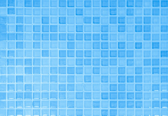 Abstract blue background with some smooth lines in it and some reflections of tile wall.