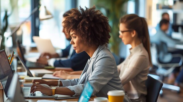 Collaborative team of business professionals working in a modern office environment with technology and networking focus