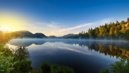 Fototapeta premium Serene lakeside view at dawn