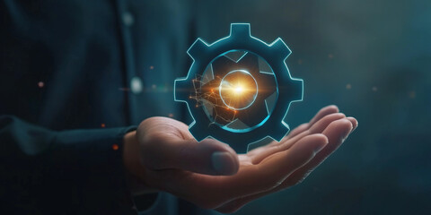 Businessman's hand is holding virtual gear icon. businessand technology concept.
