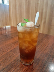 photo of iced lychee tea on the table