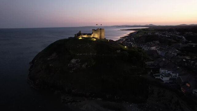 Aerial video over Castell Cricieth near Criccieth Beach Criccieth UK