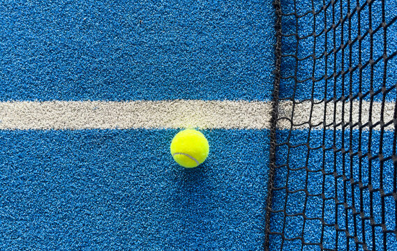 The tennis ball on the padel court