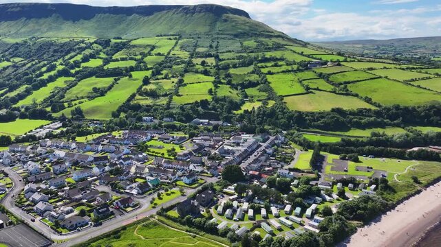 Aerial View of Residential homes and Town houses in Waterfoot Village and Lurig mountain Glenariff Co Antrim Northern Ireland