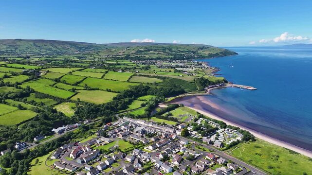 Aerial View of Residential homes and Town houses in Waterfoot Village and Lurig mountain Glenariff Co Antrim Northern Ireland