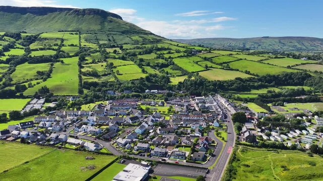 Aerial View of Residential homes and Town houses in Waterfoot Village and Lurig mountain Glenariff Co Antrim Northern Ireland