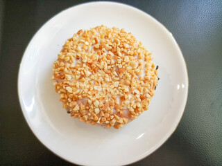 photo of peanut donuts on a white round plate