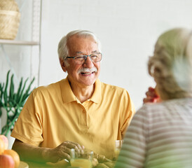 breakfast woman man senior couple home retirement wife husband elderly together happy morning old happiness kitchen love mature eating meal retired