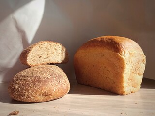 Bread made of dark and white flour. White and dark bread. Diet. The abundance of food.Warm bread from a new grain harvest, made from fresh flour. Harvesting.