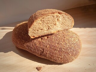 Dark bread in the cut. Diet. Background, place for text. Bakery. Food. Healthy eating. Bread in the supermarket. Baked bread.