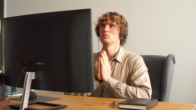 man praying near computer religion
