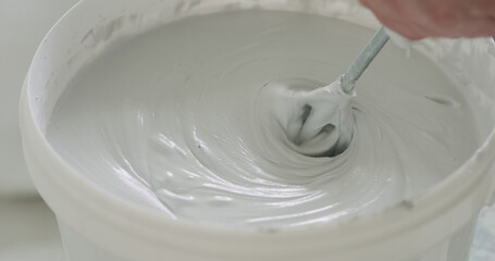 closeup mixing gray decorative concrete plaster