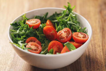 fresh salad with cherry tomatoes and arugula