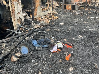 House Ruined by Fire. Fire Caused by Short Circuit. Fire Disaster. Interior of Wooden House Consumed by Fire.