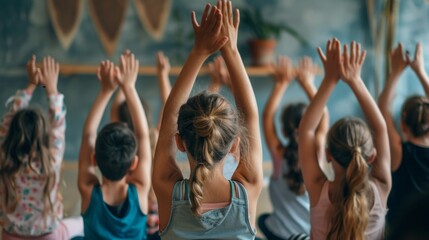 A group of children are in a yoga class