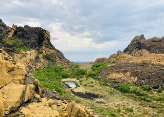 Scenic view of Leka island with unique geological rock formations in shades of yellow and brown