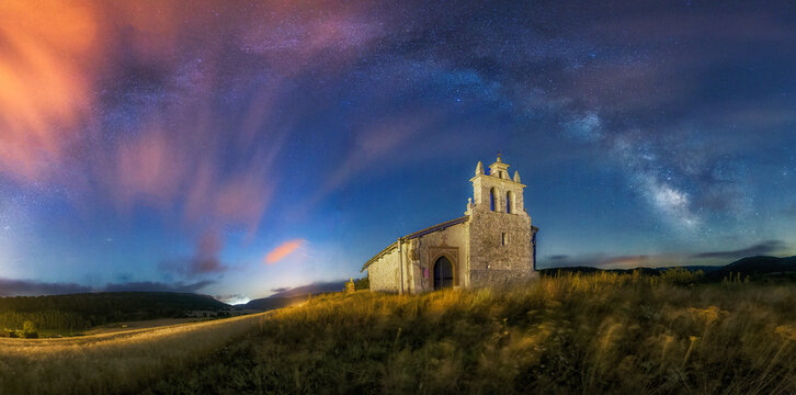Night view of the church of San Miguel Arcangel in Villacibio, Palencia, with the arch of the Milky Way crowning the sky