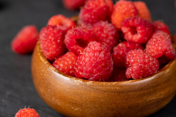 homemade harvest of ripe and healthy raspberries for food