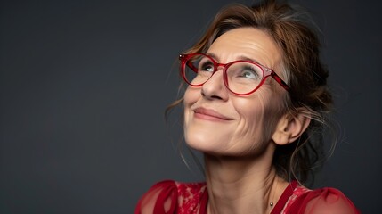 Studio portrait of smiling mature woman wearing red stylish eyeglasses looking away isolated on background copy space Advertisement concept : Generative AI